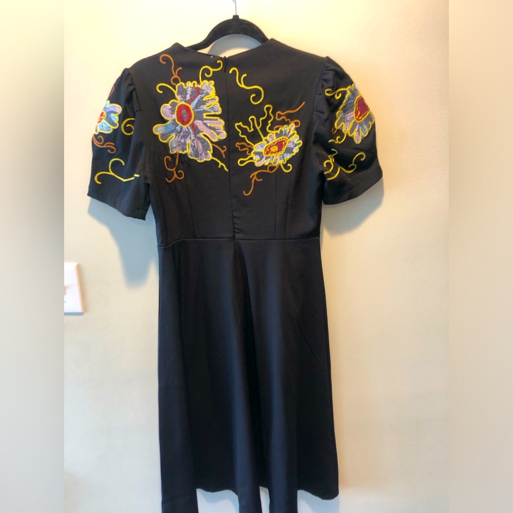 Black short sleeve dress with flowers.